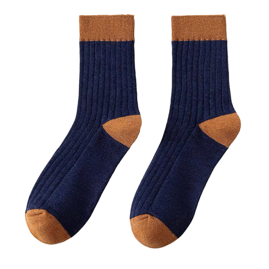Pair of navy socks with brown accents on a white background